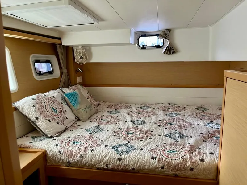 Slide: The Image of Cozy bedroom in 2017 Lagoon 39 yacht with floral bedding and natural light. - 45