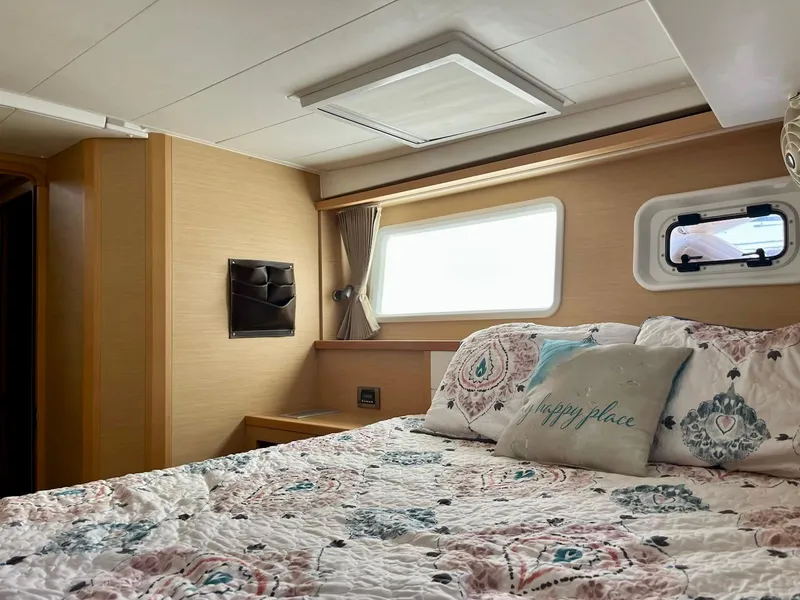 Slide: The Image of Cozy bedroom interior of 2017 Lagoon 39 yacht with floral bedding and natural light. - 46