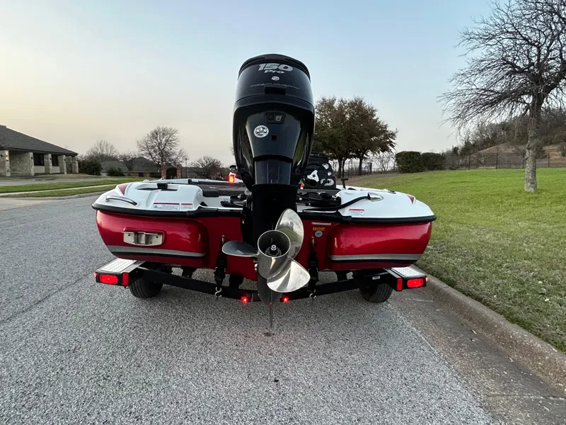 Slide: The Image of 2015 Nitro Z7 boat with powerful outboard motor on a suburban street. - 10