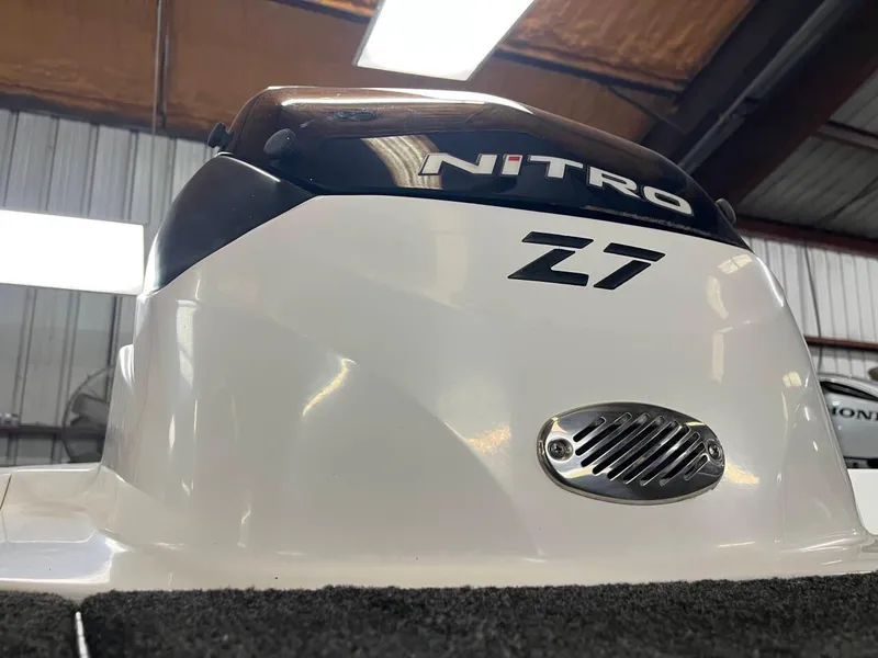 Slide: The Image of 2015 Nitro Z7 boat engine cover in a warehouse setting. - 15