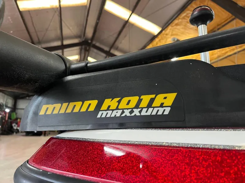 Slide: The Image of Minn Kota Maxxum trolling motor on 2015 Nitro Z7 boat in a garage. - 16