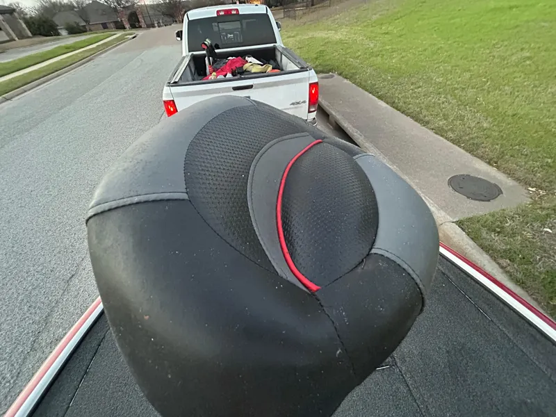 Slide: The Image of Boat seat on a 2015 Nitro Z7, parked near a white pickup truck. - 21