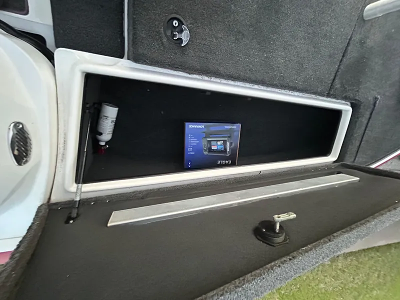 Slide: The Image of Storage compartment in a 2015 Nitro Z7 boat with a Copilot box inside. - 23