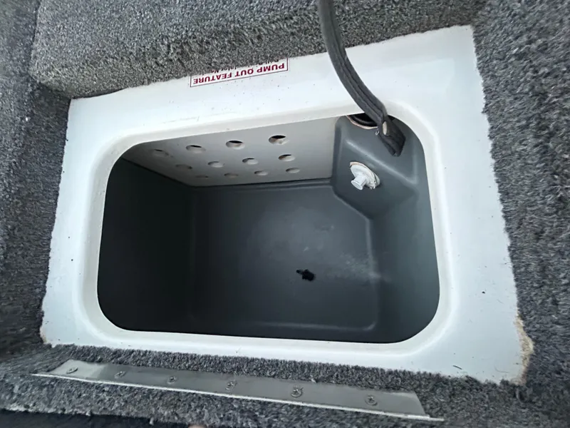 Slide: The Image of Livewell compartment in a 2015 Nitro Z7 boat, featuring a pump-out feature. - 26