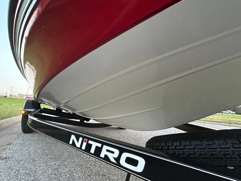 Slide: The Image of Close-up of a 2015 Nitro Z7 boat on a trailer, showcasing its sleek design. - 35