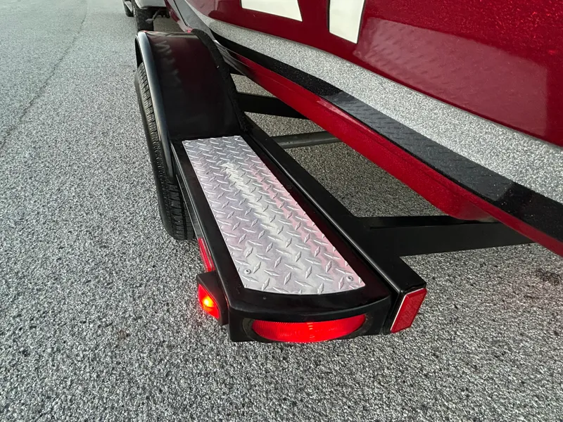 Slide: The Image of 2015 Nitro Z7 boat trailer with diamond plate step and red tail light. - 40