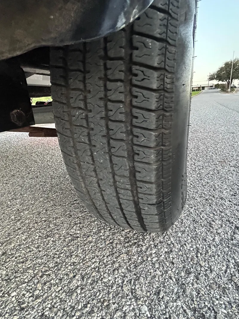 Slide: The Image of Close-up of a 2015 Nitro Z7 tire on asphalt road. - 43