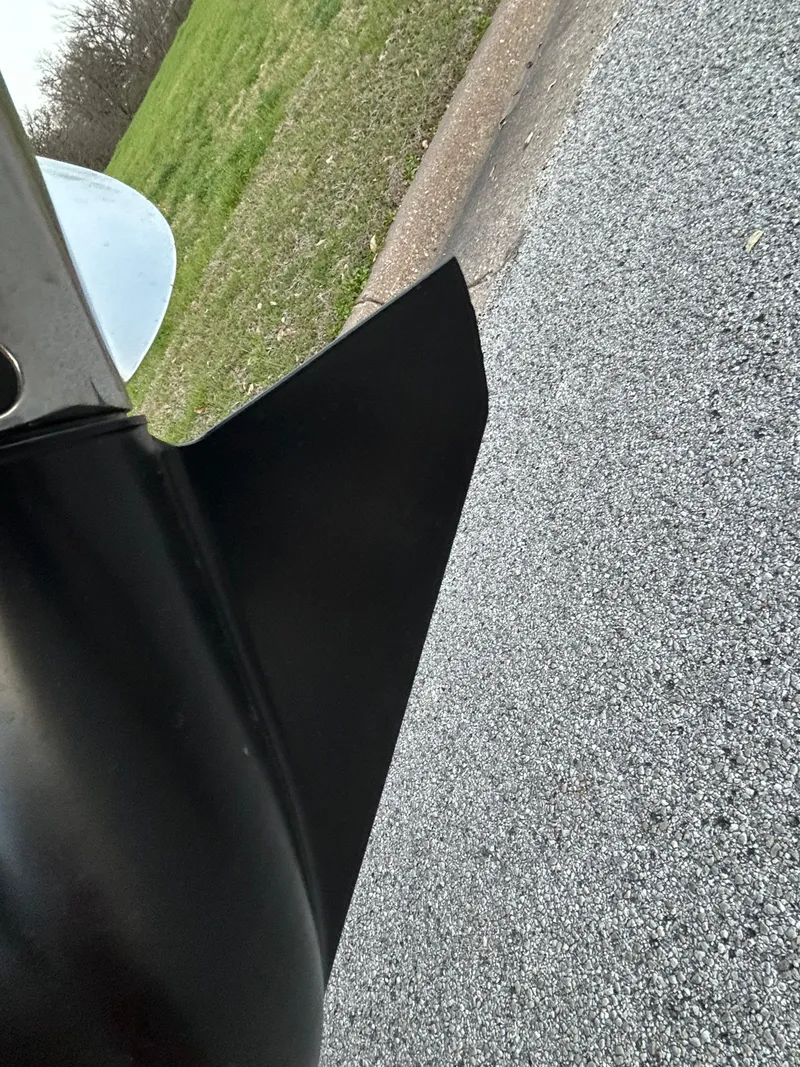 Slide: The Image of Close-up of a Nitro Z7 boat propeller against a road and grass background. - 45