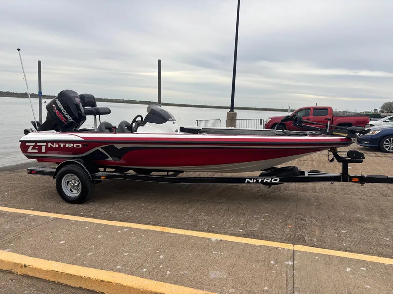 Slide: The Image of 2015 Nitro Z7 boat on trailer by waterfront, overcast sky. - 5