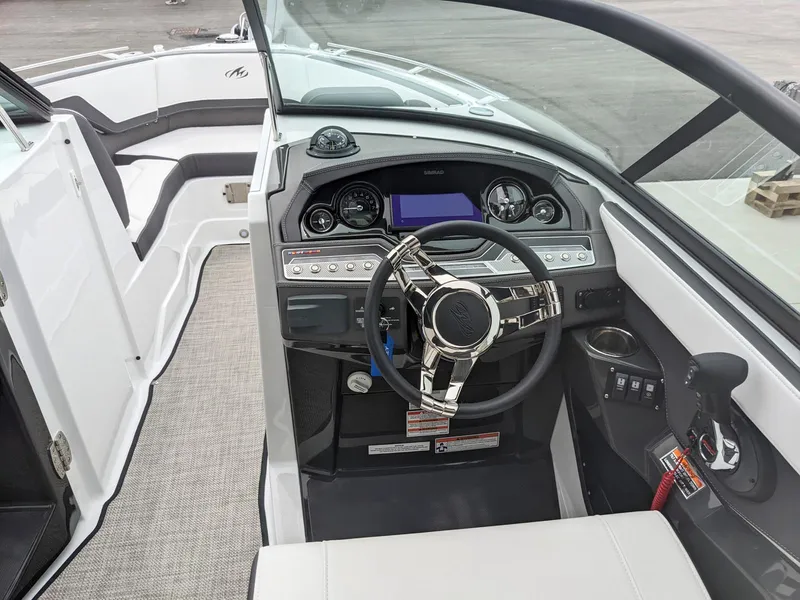 Slide: The Image of 2022 Monterey 258 Super Sport boat interior with modern dashboard and steering wheel. - 10