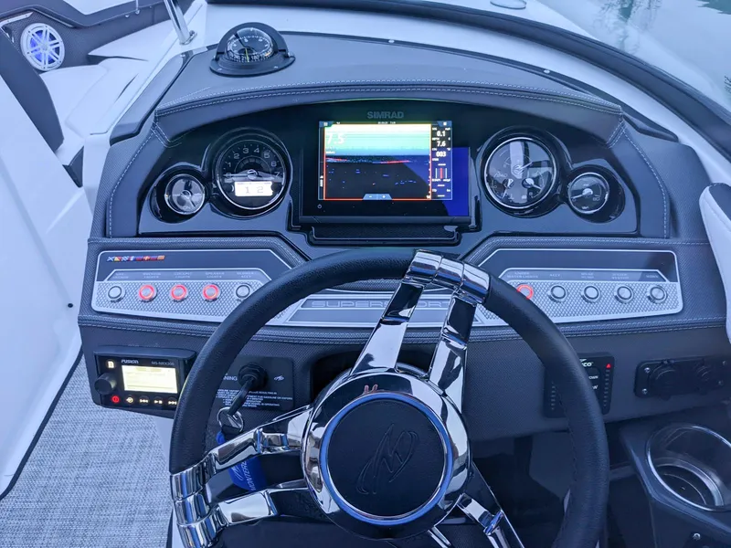 Slide: The Image of 2022 Monterey 258 Super Sport dashboard with modern controls and navigation display. - 13