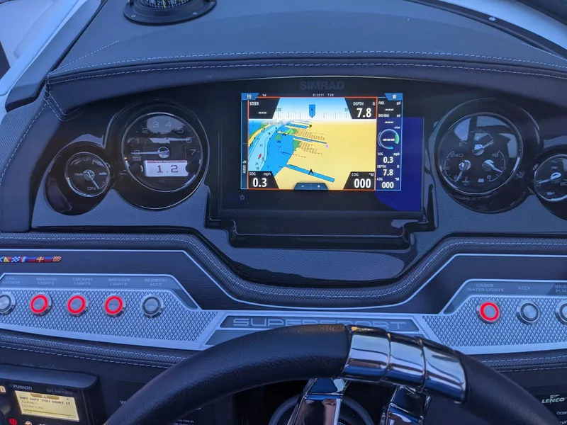 Slide: The Image of Dashboard of a 2022 Monterey 258 Super Sport boat with navigation display. - 14