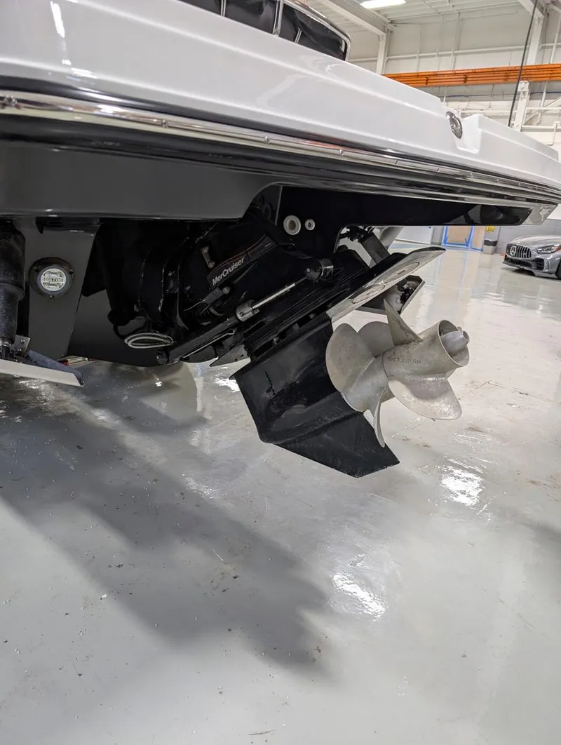 Slide: The Image of 2022 Monterey 258 Super Sport boat propeller and stern in a showroom. - 30