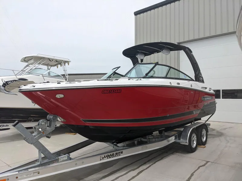 Slide: The Image of 2022 Monterey 258 Super Sport boat in red on a trailer. - 6