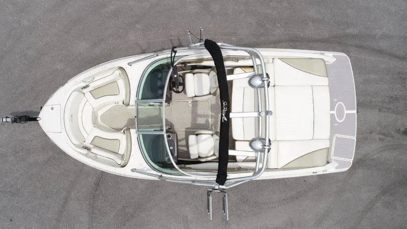 Slide: The Image of Overhead view of 2007 Sea Ray 210 Select boat with white seating and sleek design. - 10