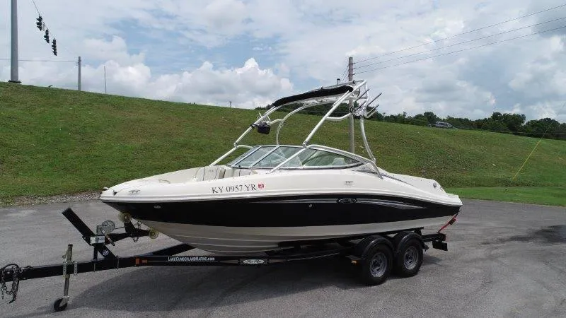 Slide: The Image of 2007 Sea Ray 210 Select boat on trailer, parked outdoors on a cloudy day. - 20