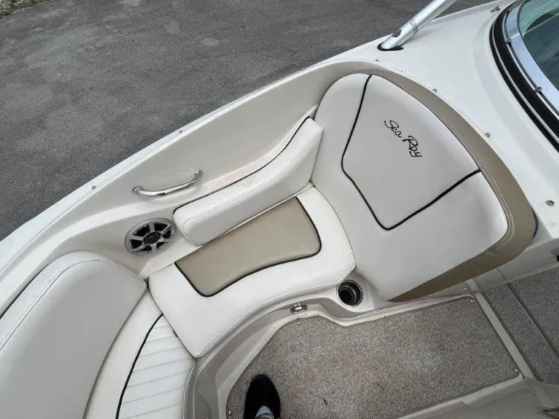 Slide: The Image of 2007 Sea Ray 210 Select boat interior with white leather seating and speaker. - 22