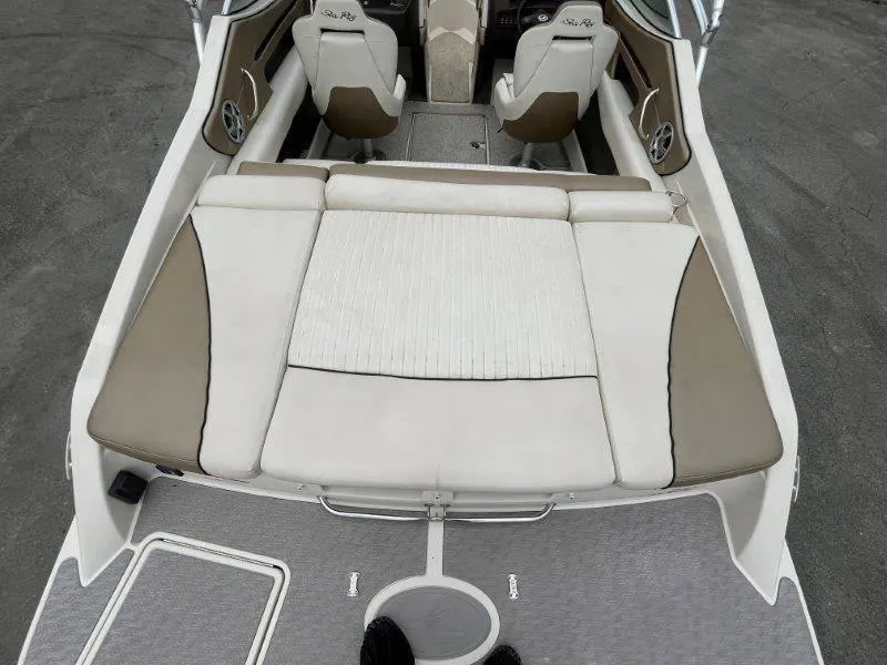 Slide: The Image of 2007 Sea Ray 210 Select boat interior with beige and white seating. - 23