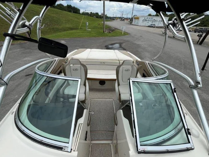 Slide: The Image of 2007 Sea Ray 210 Select boat interior with open windshield and seating. - 33
