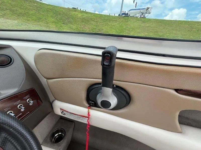 Slide: The Image of Interior view of a 2007 Sea Ray 210 Select boat with throttle control. - 40