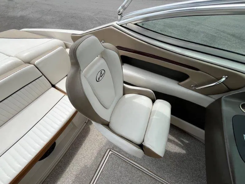 Slide: The Image of 2007 Sea Ray 210 Select boat interior with white seating and sleek design. - 46