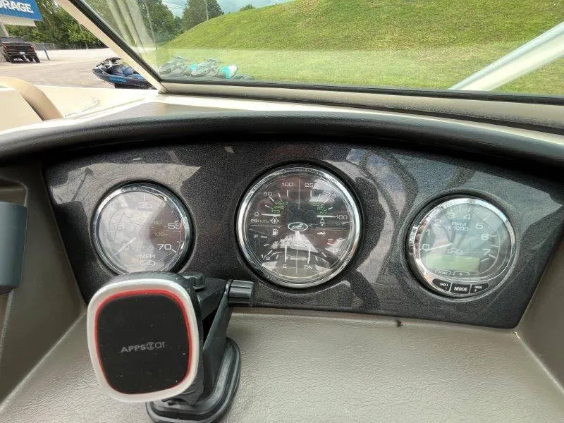 Slide: The Image of Dashboard of a 2007 Sea Ray 210 Select boat with gauges and phone mount. - 47