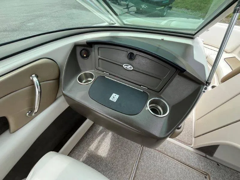 Slide: The Image of 2007 Sea Ray 210 Select boat interior with dashboard and cup holders. - 49