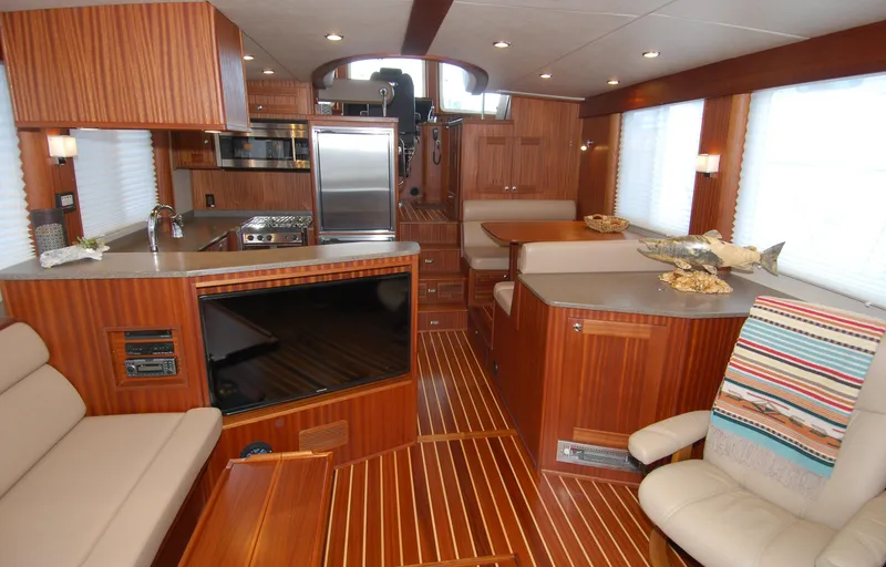 Slide: The Image of Luxurious interior of 2015 American Tug 485 with wood finishes and modern amenities. - 10