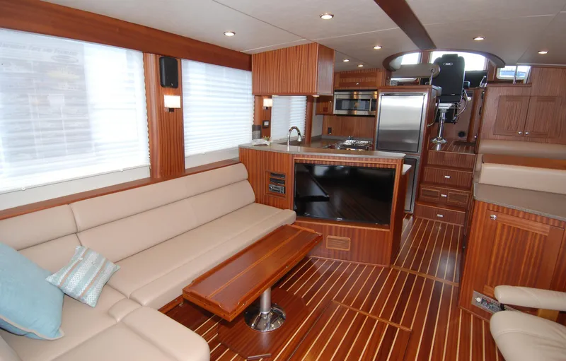 Slide: The Image of Luxurious interior of 2015 American Tug 485 with modern kitchen and comfortable seating. - 11