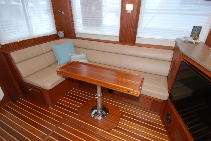 Slide: The Image of Luxurious interior of 2015 American Tug 485 with wood accents and comfortable seating. - 12