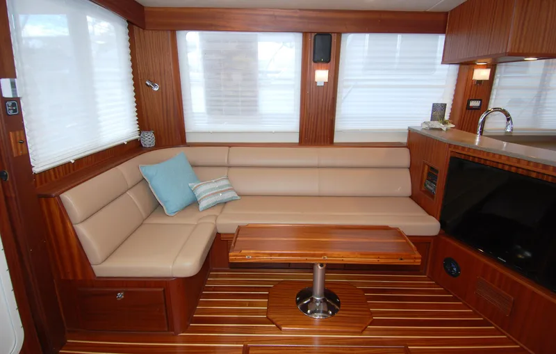 Slide: The Image of Luxurious interior of 2015 American Tug 485 with plush seating and wooden accents. - 14