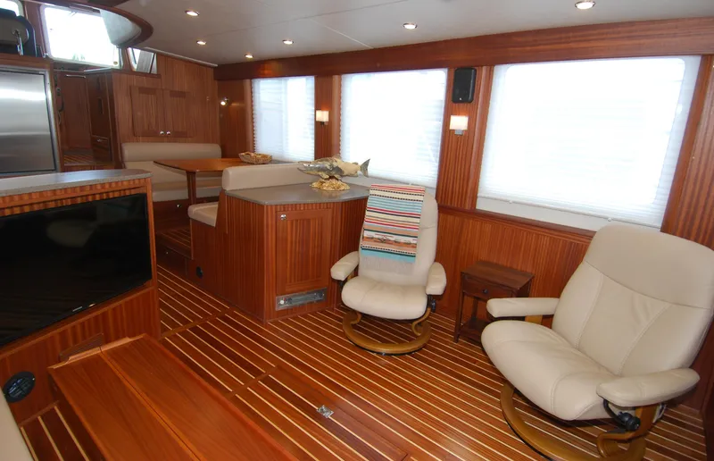 Slide: The Image of Luxurious interior of 2015 American Tug 485 with wooden flooring and comfortable seating. - 19