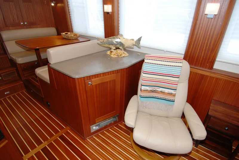 Slide: The Image of Luxurious interior of 2015 American Tug 485 with wood paneling and comfortable seating. - 20