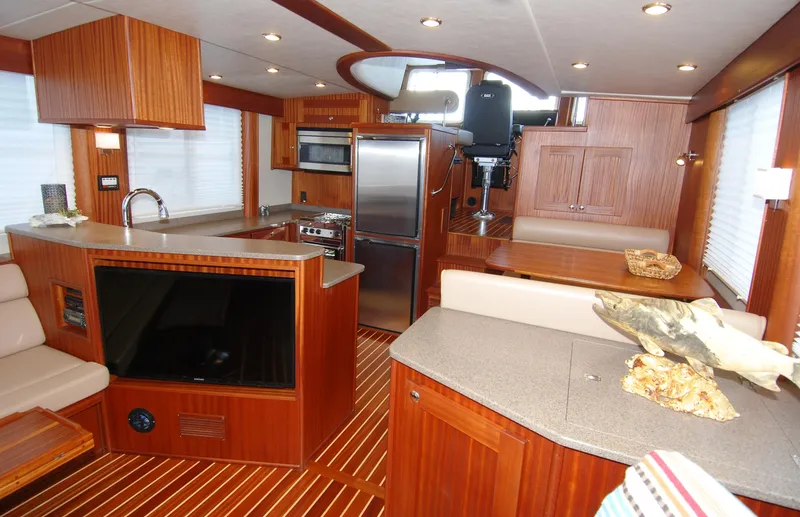 Slide: The Image of Luxurious interior of 2015 American Tug 485 with modern kitchen and cozy seating area. - 23