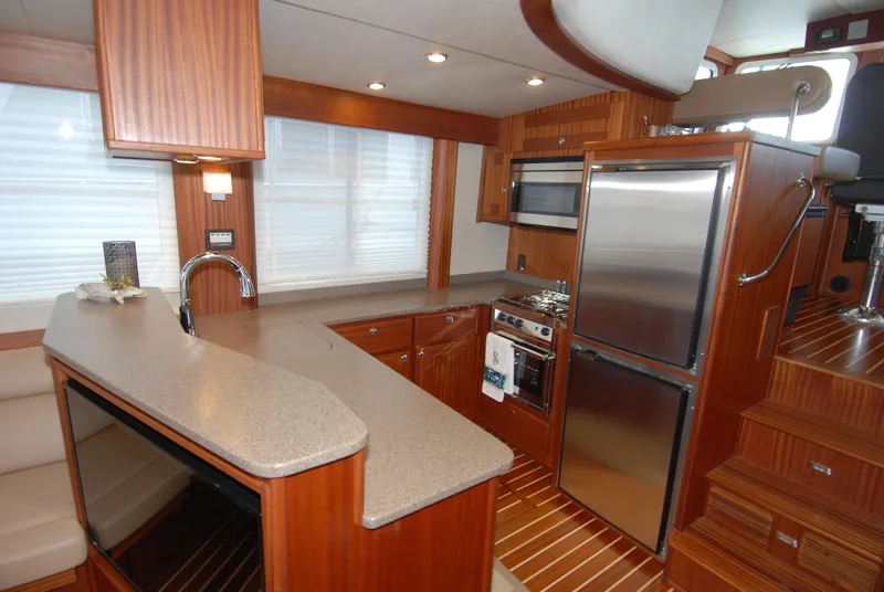 Slide: The Image of Luxurious kitchen interior of 2015 American Tug 485 with modern appliances and wood finish. - 31