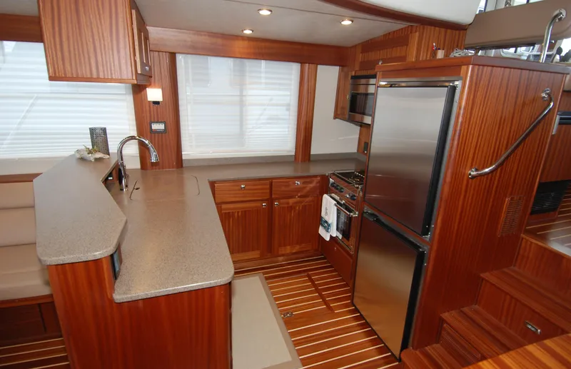 Slide: The Image of Luxurious 2015 American Tug 485 kitchen with wood cabinetry and modern appliances. - 32