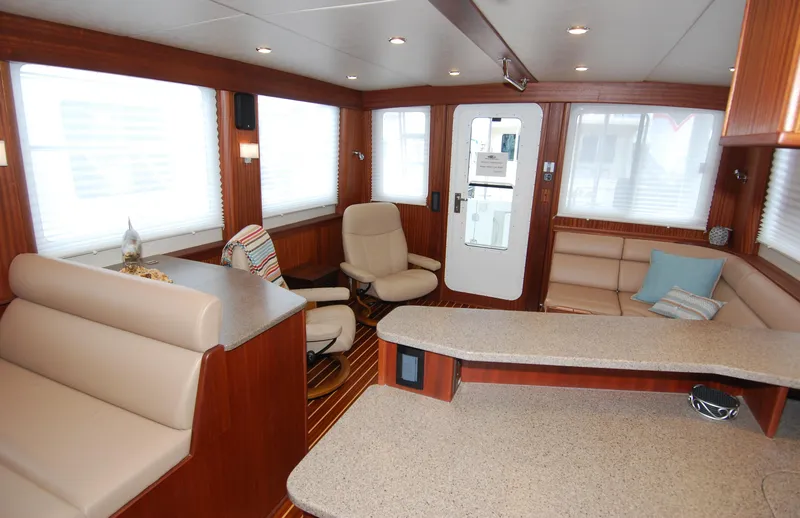 Slide: The Image of Interior of 2015 American Tug 485, featuring cozy seating and modern design elements. - 39
