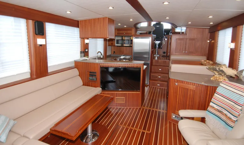 Slide: The Image of Luxurious interior of 2015 American Tug 485 with modern kitchen and comfortable seating. - 9