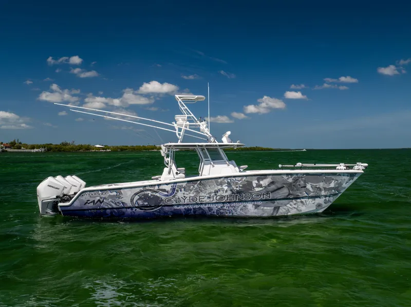 Slide: The Image of 2023 Freeman 37 VH boat on green water under blue sky. - 0