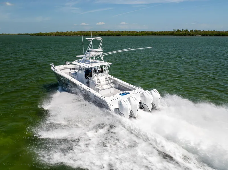 Slide: The Image of Freeman 37 VH 2023 boat cruising on open water, showcasing powerful engines and sleek design. - 16