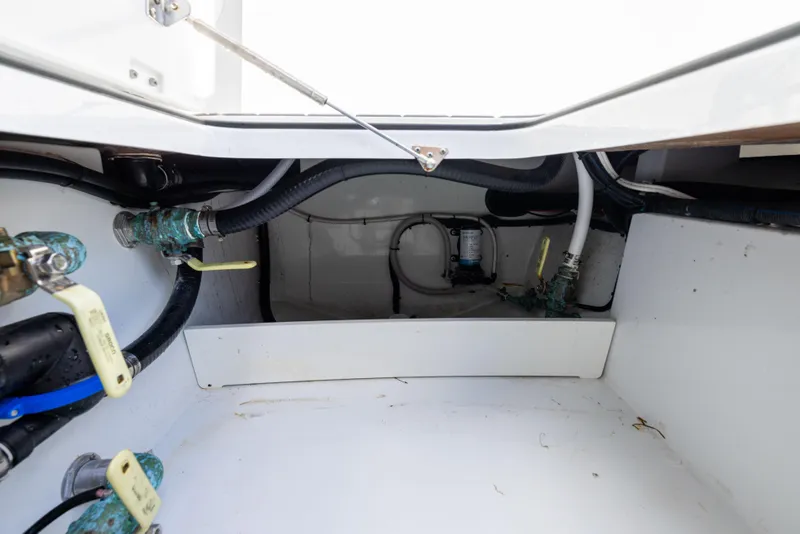 Slide: The Image of Freeman 37 VH 2023 boat interior showing plumbing and wiring components. - 28