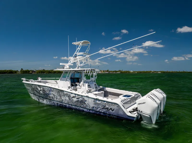 Slide: The Image of 2023 Freeman 37 VH boat on green water under clear blue sky. - 3