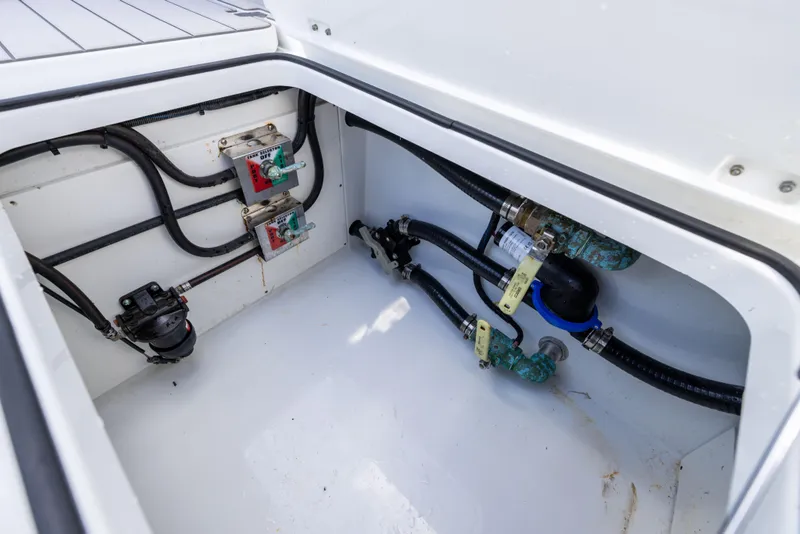 Slide: The Image of Freeman 37 VH 2023 boat compartment with wiring and plumbing components. - 30