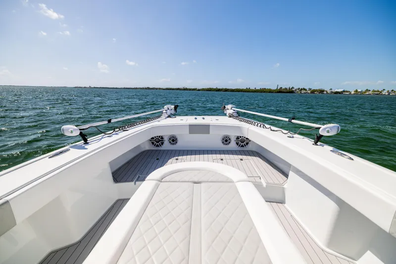 Slide: The Image of Freeman 37 VH 2023 boat on open water, showcasing spacious deck and clear skies. - 47