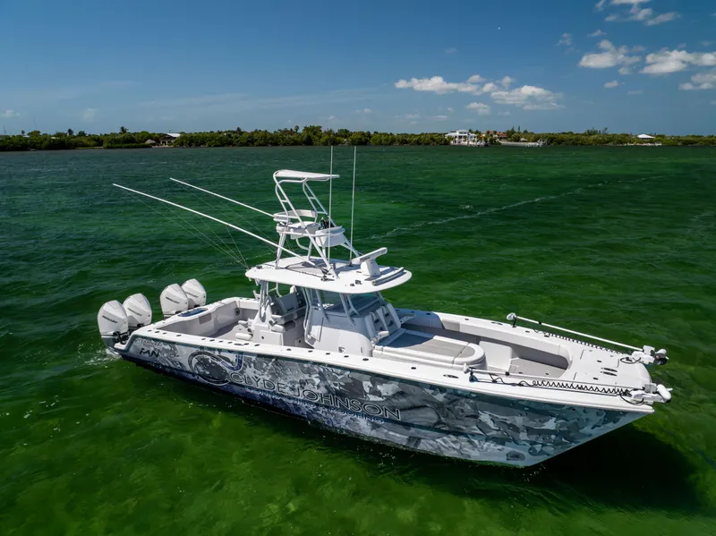 Slide: The Image of 2023 Freeman 37 VH boat on green water, clear sky background. - 5