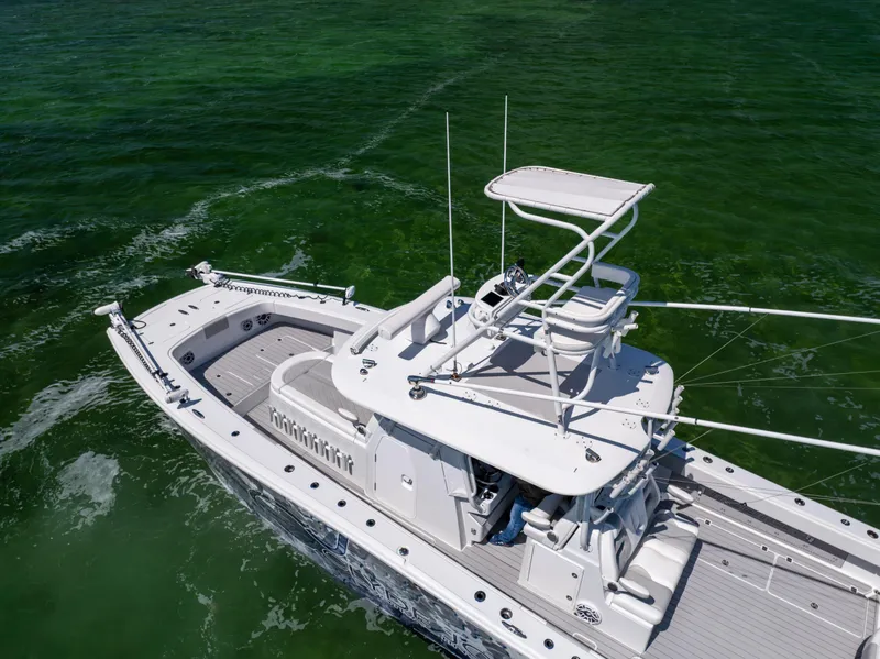 Slide: The Image of 2023 Freeman 37 VH boat cruising on clear green water. - 7