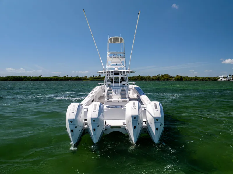 Slide: The Image of 2023 Freeman 37 VH boat with four engines on open water. - 8