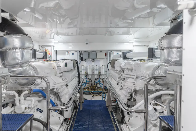 Slide: The Image of Engine room of 2015 Ocean Alexander 72 yacht, featuring dual engines and modern equipment. - 10