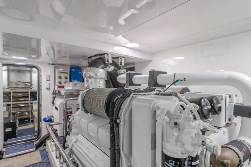 Slide: The Image of Engine room of 2015 Ocean Alexander 72 yacht, showcasing advanced machinery and equipment. - 16