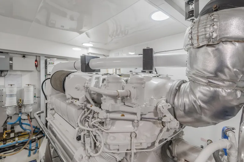 Slide: The Image of Engine room of 2015 Ocean Alexander 72 yacht, showcasing advanced machinery and components. - 17